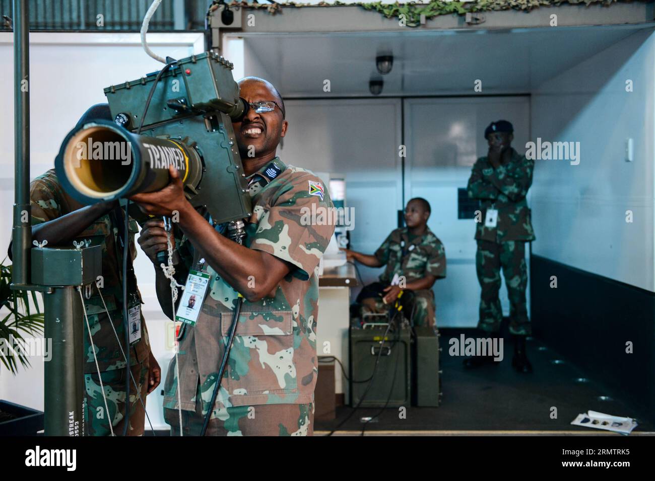 (140917) -- CENTURION, Sept. 17, 2014 -- A South African military officer tests an ultra short missile launch system during the first day of Africa Aerospace and Defense 2014 Exhibition in Waterkoof Air Force Basement on the southern outskirts of the administrative capital of Pretoria, on Sept. 17, 2014. The exhibition is the largest one of its kind in Africa. A total of 347 exhibitors from 26 countries and regions took part in the biennial exhibition which will last till Sept. 21. ) (djj) SOUTH AFRICA-PRETORIA-CENTURION-AFRICA AEROSPACE AND DEFENSE 2014 EXHIBITION ZhaixJianlan PUBLICATIONxNOT Stock Photo