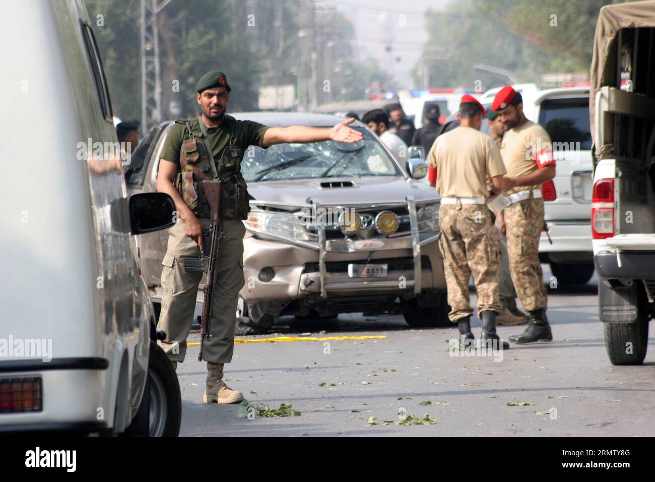 (140923) -- PESHAWAR, Sept. 23, 2014 -- Pakistani soldiers cordon off the blast site in northwest Pakistan s Peshawar on Sept. 23, 2014. At least three people were killed and 13 others were injured when a Paramilitary troops convoy came under attack in Pakistan s northwest Peshawar city on Tuesday morning, officials said. ) PAKISTAN-PESHAWAR-BLAST-SITE AhmadxSidique PUBLICATIONxNOTxINxCHN   Peshawar Sept 23 2014 Pakistani Soldiers Cordon off The Blast Site in Northwest Pakistan S Peshawar ON Sept 23 2014 AT least Three Celebrities Were KILLED and 13 Others Were Injured When a paramilitary Troo Stock Photo