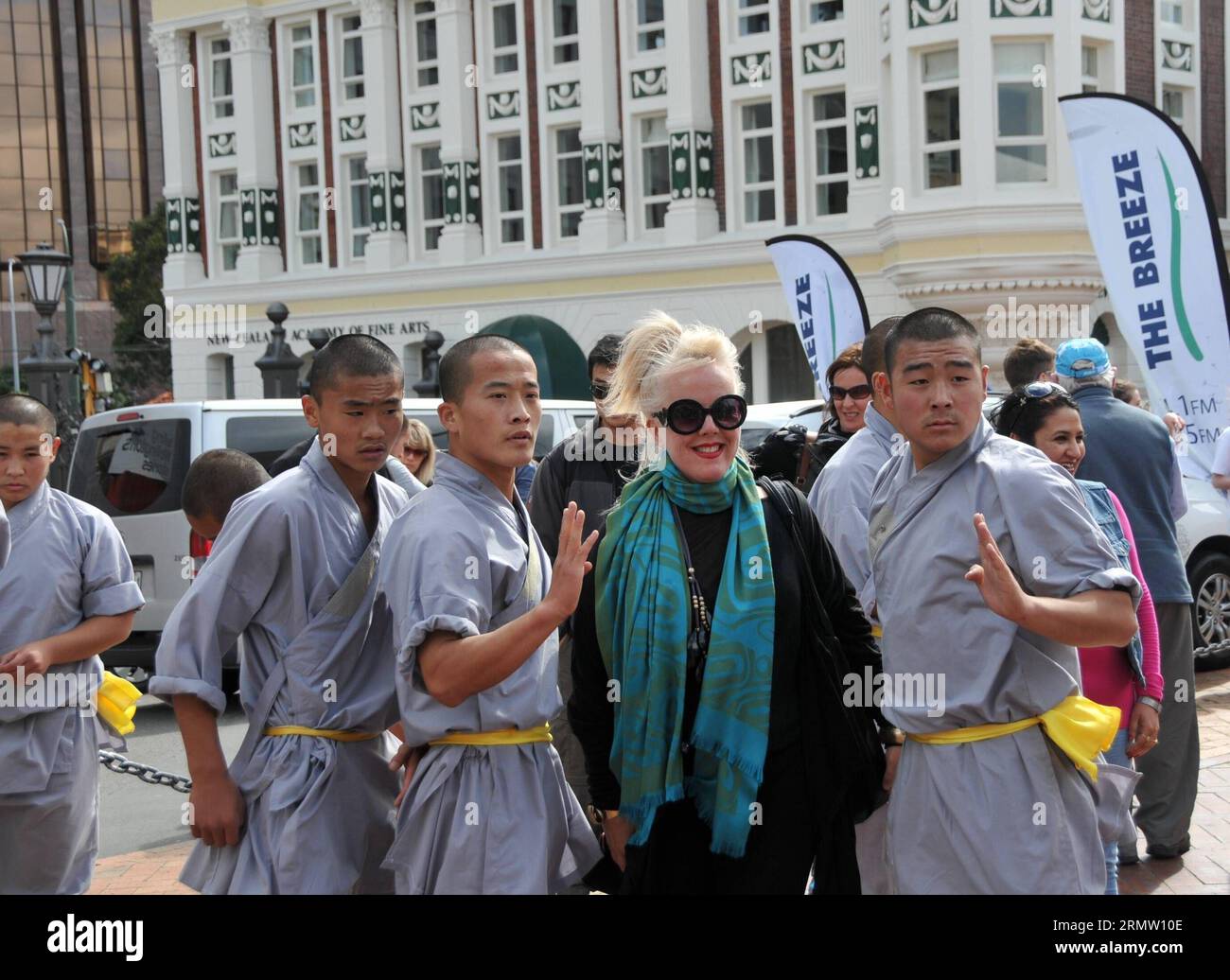 (140926) -- WELLINGTON, Sept. 26, 2014 -- Chinese Kungfu monks pose for photos with local people in Wellington, New Zealand, Spet. 26, 2014. The iconic Shaolin Kungfu Monk Troupe arrived in Wellington to attend the World of Wearable (WOW) Art Awards Shows. ) NEW ZEALAND-WELLINGTON-CHINA-KUNGFU MONK SuxLiang PUBLICATIONxNOTxINxCHN   Wellington Sept 26 2014 Chinese Kungfu Monks Pose for Photos With Local Celebrities in Wellington New Zealand  26 2014 The  Shaolin Kungfu Monk Troupe arrived in Wellington to attend The World of Wearable Wow Art Awards Shows New Zealand Wellington China Kungfu Monk Stock Photo
