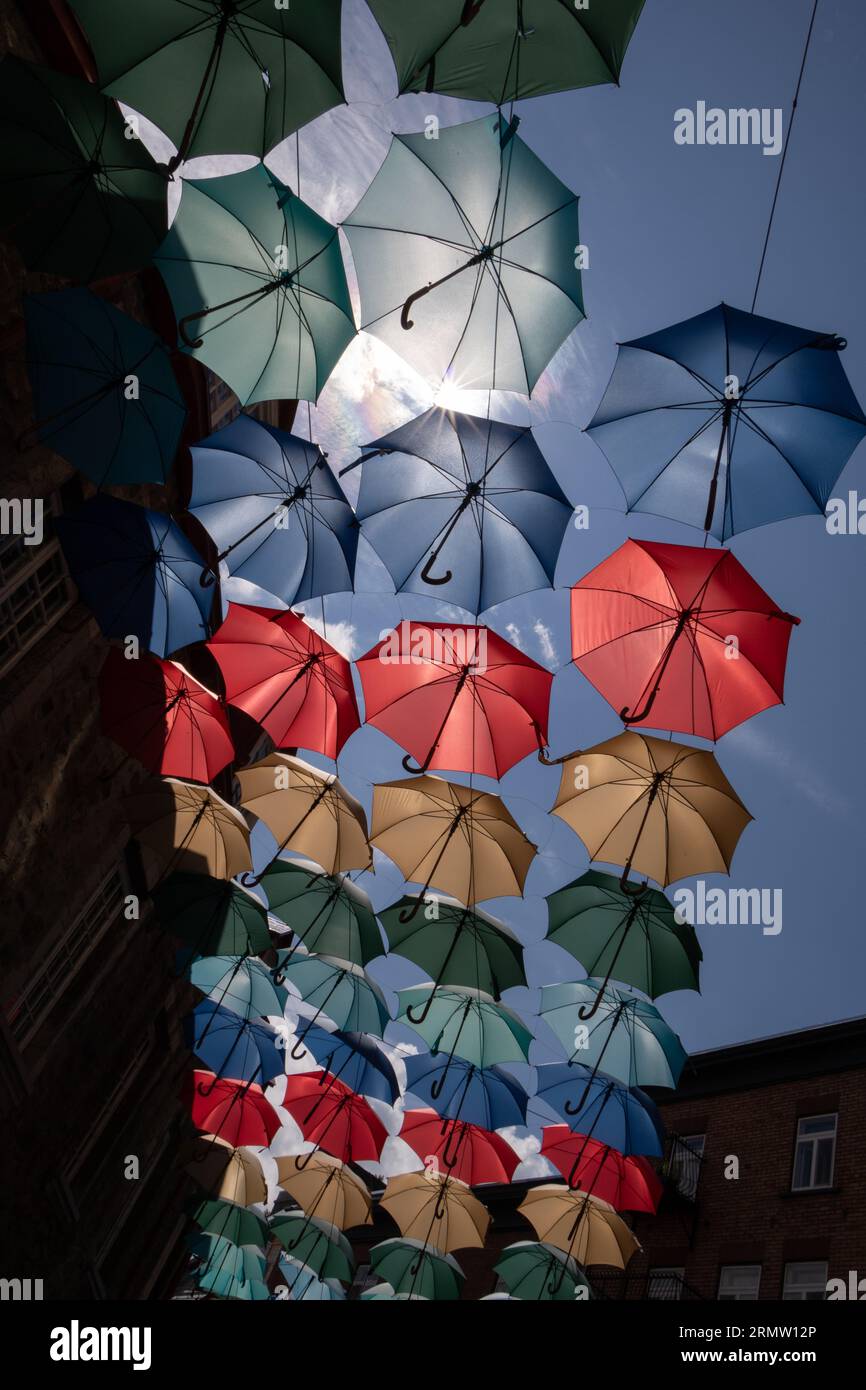 Bright and colourful umbrellas over Quebec city street Stock Photo