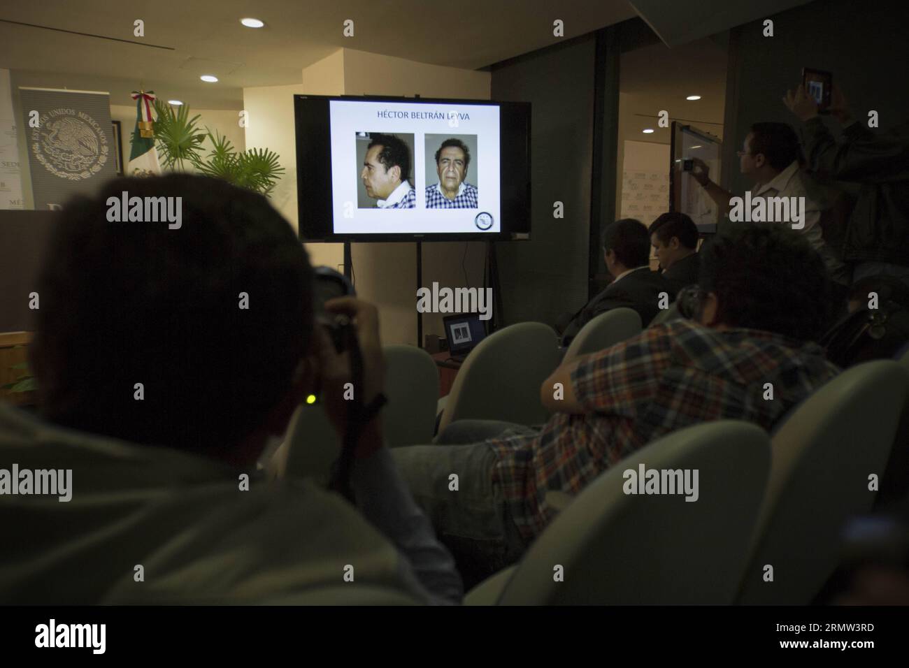 mexico-city-oct-1-2014-people-watch-an-image-projected-on-a