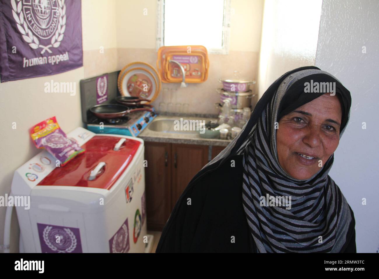 GAZA, Oct. 1, 2014 -- A Palestinian checks her new mobile home after they were made homeless in the recent Israeli-Hamas war, in Khuzaa neighborhood in the southern Gaza Strip city of Khan Younis, on October 1, 2014. ) MIDEAST-GAZA- MOBILE-HOMES KhaledxOmar PUBLICATIONxNOTxINxCHN   Gaza OCT 1 2014 a PALESTINIAN Checks her New Mobile Home After They Were Made Home in The Recent Israeli Hamas was in  Neighborhood in The Southern Gaza Strip City of Khan Younis ON October 1 2014 Mideast Gaza Mobile Homes  PUBLICATIONxNOTxINxCHN Stock Photo