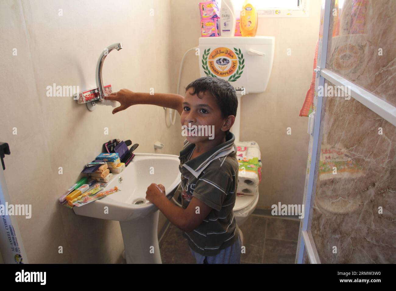 GAZA, Oct. 1, 2014 -- A Palestinian boy checks his new mobile home after they were made homeless in the recent Israeli-Hamas war, in Khuzaa neighborhood in the southern Gaza Strip city of Khan Younis, on October 1, 2014. ) MIDEAST-GAZA- MOBILE-HOMES KhaledxOmar PUBLICATIONxNOTxINxCHN   Gaza OCT 1 2014 a PALESTINIAN Boy Checks His New Mobile Home After They Were Made Home in The Recent Israeli Hamas was in  Neighborhood in The Southern Gaza Strip City of Khan Younis ON October 1 2014 Mideast Gaza Mobile Homes  PUBLICATIONxNOTxINxCHN Stock Photo