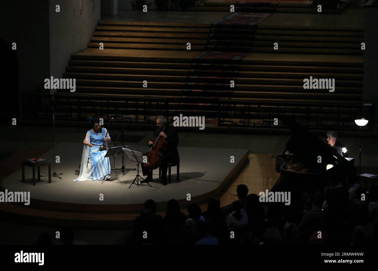 (141003) -- FRANKFURT, Oct. 3, 2014 -- Chinese musician Ma Xiaohui (L) performs Erhu, a two-stringed wooden instrument, with German violinist Daniel Robert Graf and German pianist Carl-Martin Buttgereit during a cencert held at a cathedral in Frankfurt, Germany, on Oct. 3, 2014. ) GERMANY-FRANKFURT-MA XIAOHUI-CONCERT LuoxHuanhuan PUBLICATIONxNOTxINxCHN   Frankfurt OCT 3 2014 Chinese Musician MA Xiaohui l performs Erhu a Two stringed Wooden Instrument With German Violinist Daniel Robert Graf and German Pianist Carl Martin Buttgereit during a  Hero AT a Cathedral in Frankfurt Germany ON OCT 3 20 Stock Photo