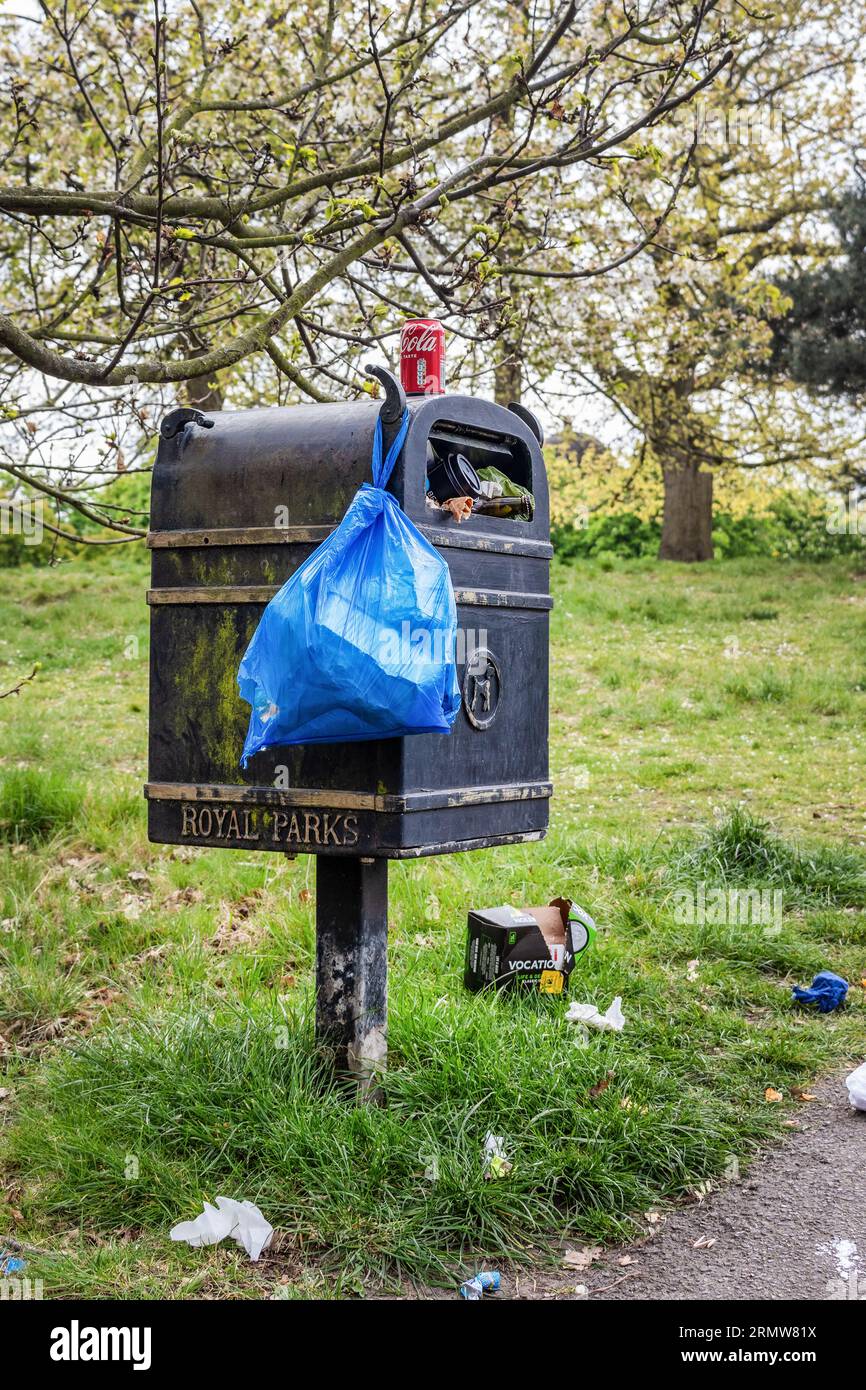 Overflowing Dog waste bin taken in Greenwich park full of rubbish and