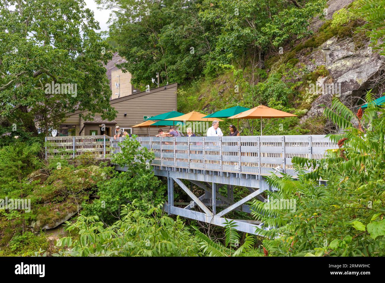 Chimney Rock, North Carolina, USA - August 11, 2023:View of the Sky Lounge and foot bridge at Chimney Rock State Park. Stock Photo