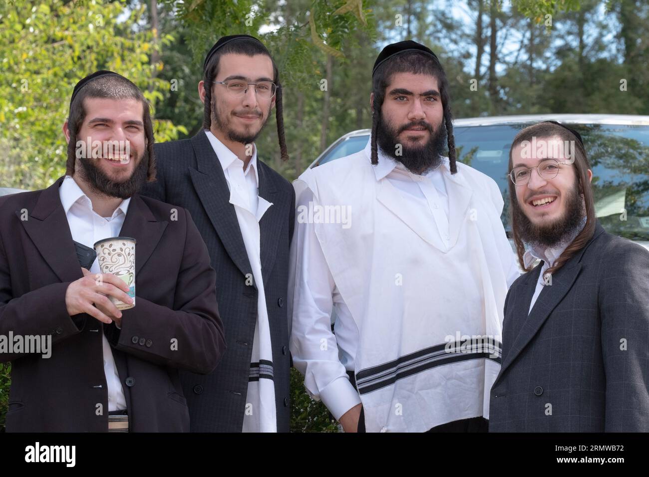 4 ultra orthodox Jewish young men outside a temple in Monsey, Rockland