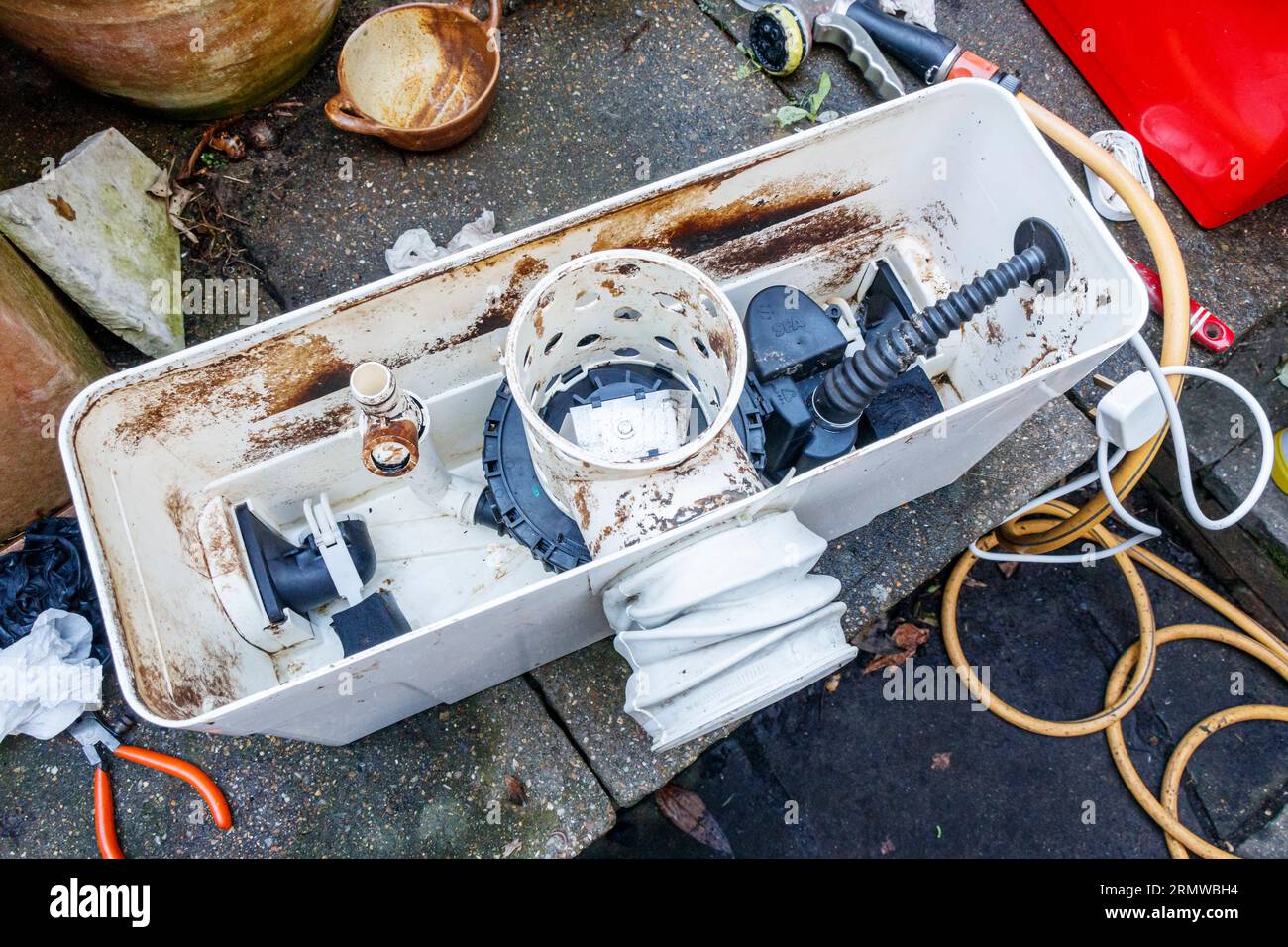 A Saniflo Saniplus macerator with its lid removed, cleaned, repaired and ready to be reinstalled Stock Photo