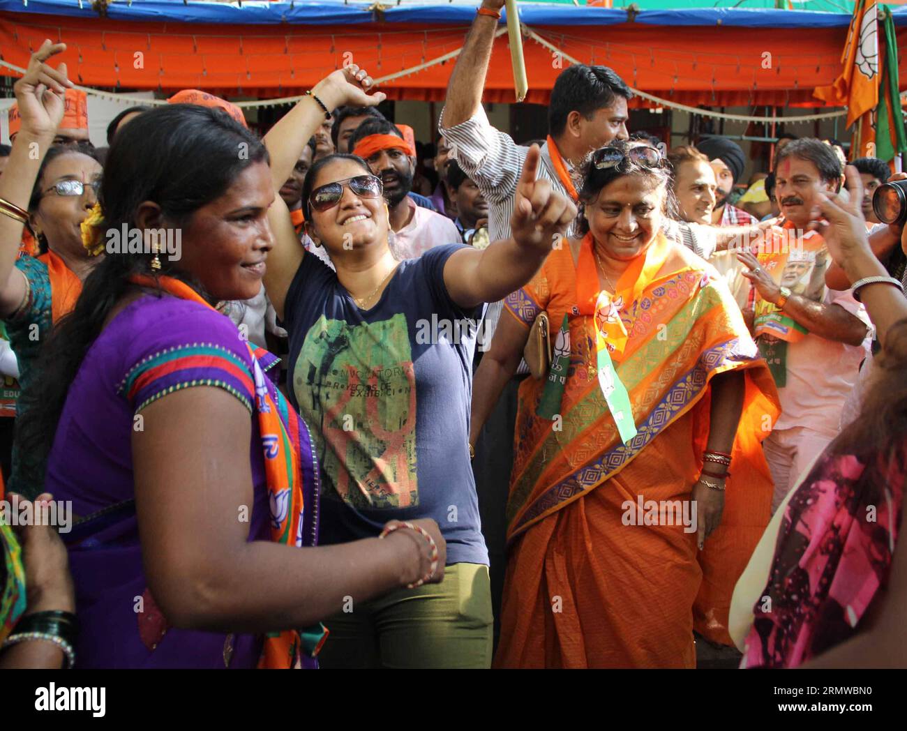 (141019) -- MUMBAI, Oct. 19, 2014 -- Supporters of India s ruling Bharatiya Janata Party (BJP) celebrate as early results indicated the party leading in the Maharashtra state assembly elections in Mumbai, India, Oct. 19, 2014. India s ruling Bharatiya Janata Party (BJP) has won control of the country s financial capital Mumbai through a legislative election in the state of Maharashtra, while also grasping the northern state of Haryana from the Congress, said vote counting results Sunday. ) INDIA-MUMBAI-BJP-CELEBRATION Stringer PUBLICATIONxNOTxINxCHN   Mumbai OCT 19 2014 Supporters of India S r Stock Photo