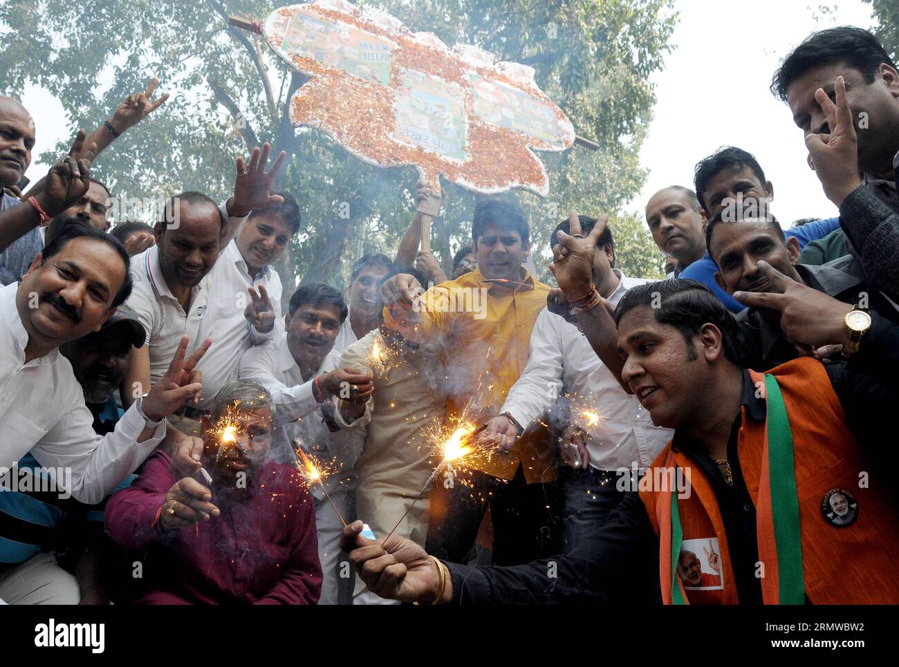Bharatiya Janata Party (BJP) supporters celebrate outside the BJP headquarters as Haryana and Maharashtra states assembly elections results come out in New Delhi, India on Oct.19, 2014. India s ruling BJP has won control of the country s financial capital Mumbai through a legislative election in the state of Maharashtra, while also grasping the northern state of Haryana from the Congress, said vote counting results Sunday. )(wxl) INDIA-NEW DELHI-BJP-CELEBRATION ParthaxSarkar PUBLICATIONxNOTxINxCHN   Bharatiya Janata Party BJP Supporters Celebrate outside The BJP Headquarters As Haryana and Mah Stock Photo