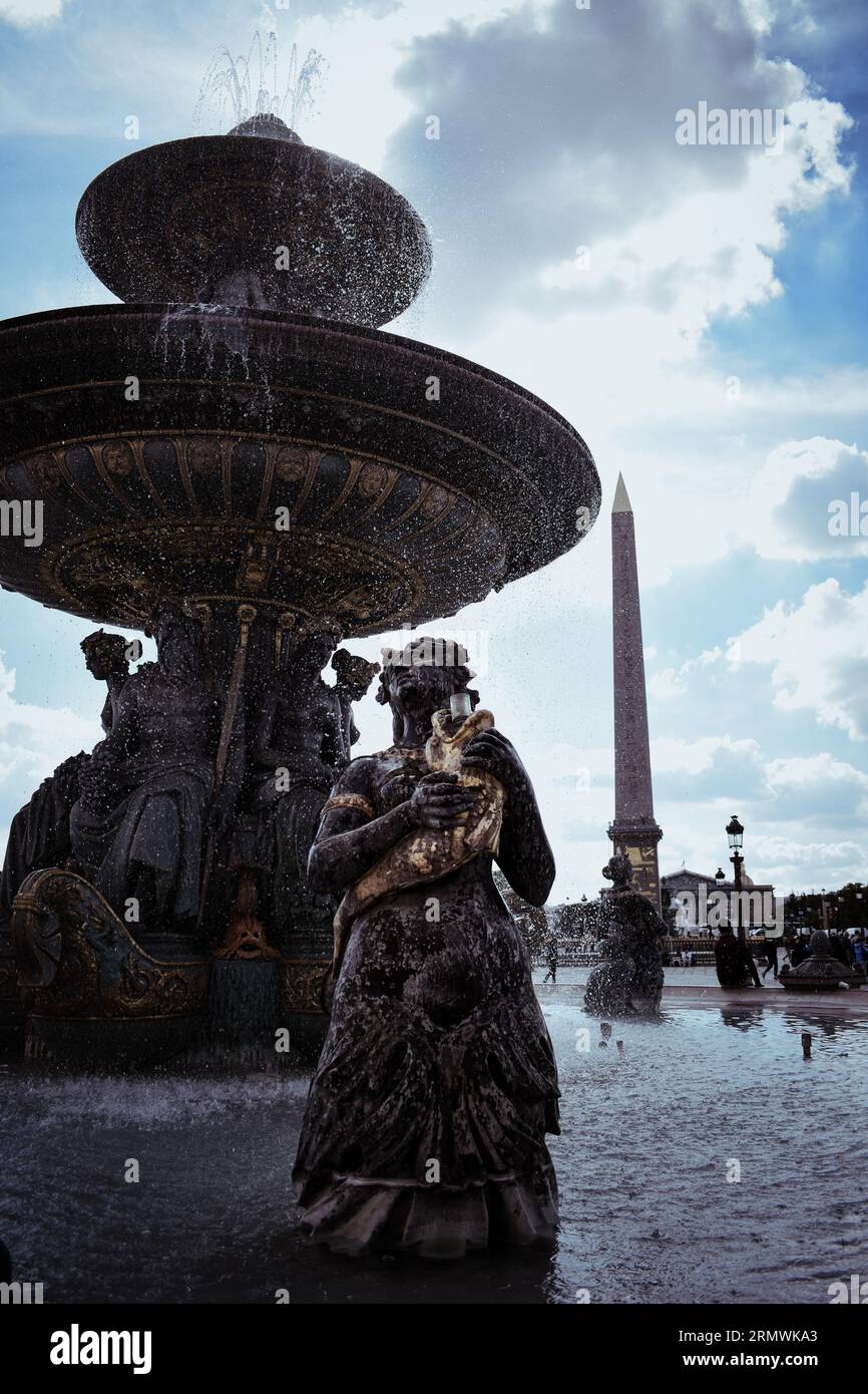 La Fountaine des Fleuves with the Luxor Obelisk in the background on the Place de la Concorde, Paris, France Stock Photo