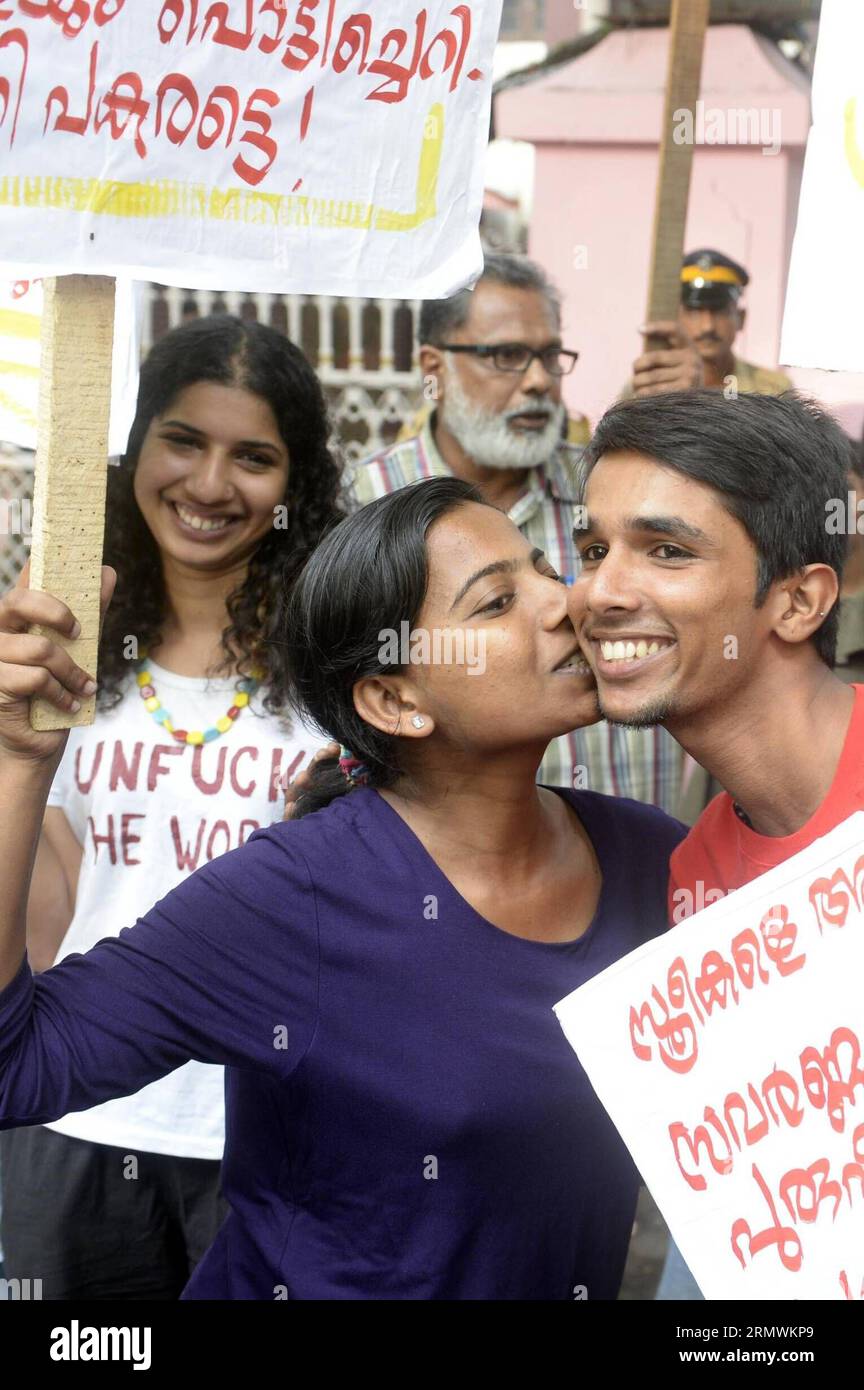 (141103) -- KOCHI, Nov. 2, 2014 -- An Indian woman protestor kisses another protestor to express support to the Kiss of Love protest against the increasing moral policing in the southern Kerala state before being arrested by the police in Kochi, India, Nov. 2, 2014. Kissing and public displays of affection are generally taboo in India. ) INDIA-KOCHI-PROTEST Stringer PUBLICATIONxNOTxINxCHN   Kochi Nov 2 2014 to Indian Woman protestor Kisses Another protestor to Shipping Support to The Kiss of Love Protest against The Mostly Morality policing in The Southern Kerala State Before Being Arrested by Stock Photo