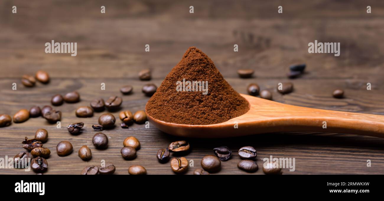 spoon with powder and coffee beans on old wooden spoon Stock Photo - Alamy