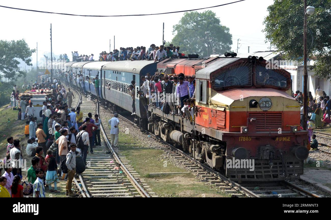 (141107) -- BAREILY,   An overcrowded passenger train passes near Bareily as people travel to take a holy dip in the river Ganga on the occasion of Hindu festival Kartik Purnima in Uttar Pradesh, India, Nov. 6, 2014. ) (azp) INDIA-BAREILY-TRAIN Stringer PUBLICATIONxNOTxINxCHN   to Overcrowded Passenger Train Pass Near  As Celebrities Travel to Take a Holy Dip in The River Ganga ON The Occasion of Hindu Festival Kartik PURNIMA in Uttar Pradesh India Nov 6 2014 EGP India  Train Stringer PUBLICATIONxNOTxINxCHN Stock Photo