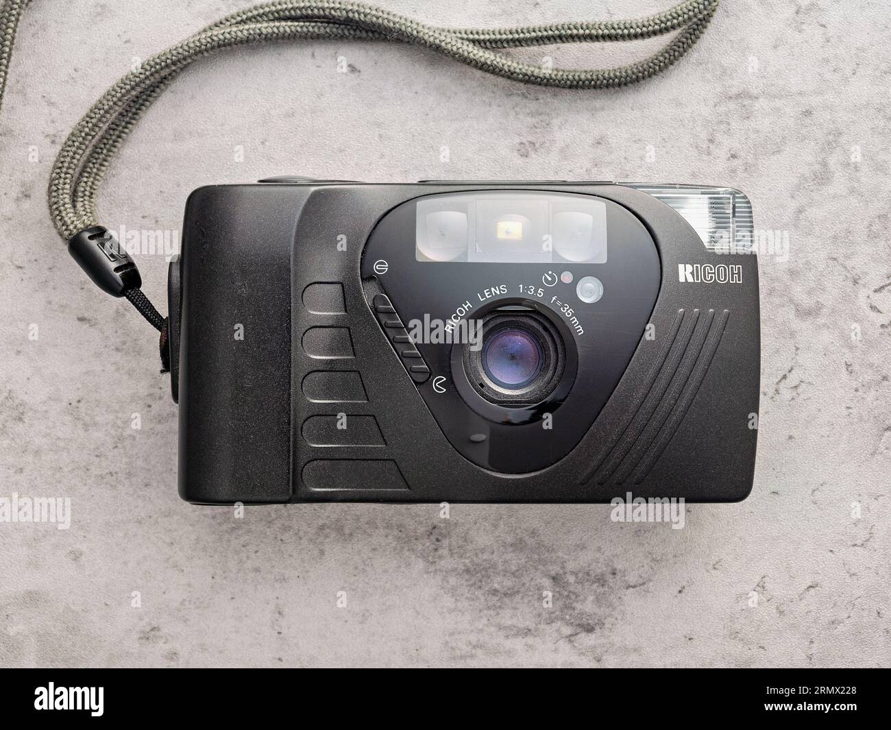 Ricoh 35mm point and shoot film camera black camera on a mottled grey background Stock Photo Alamy