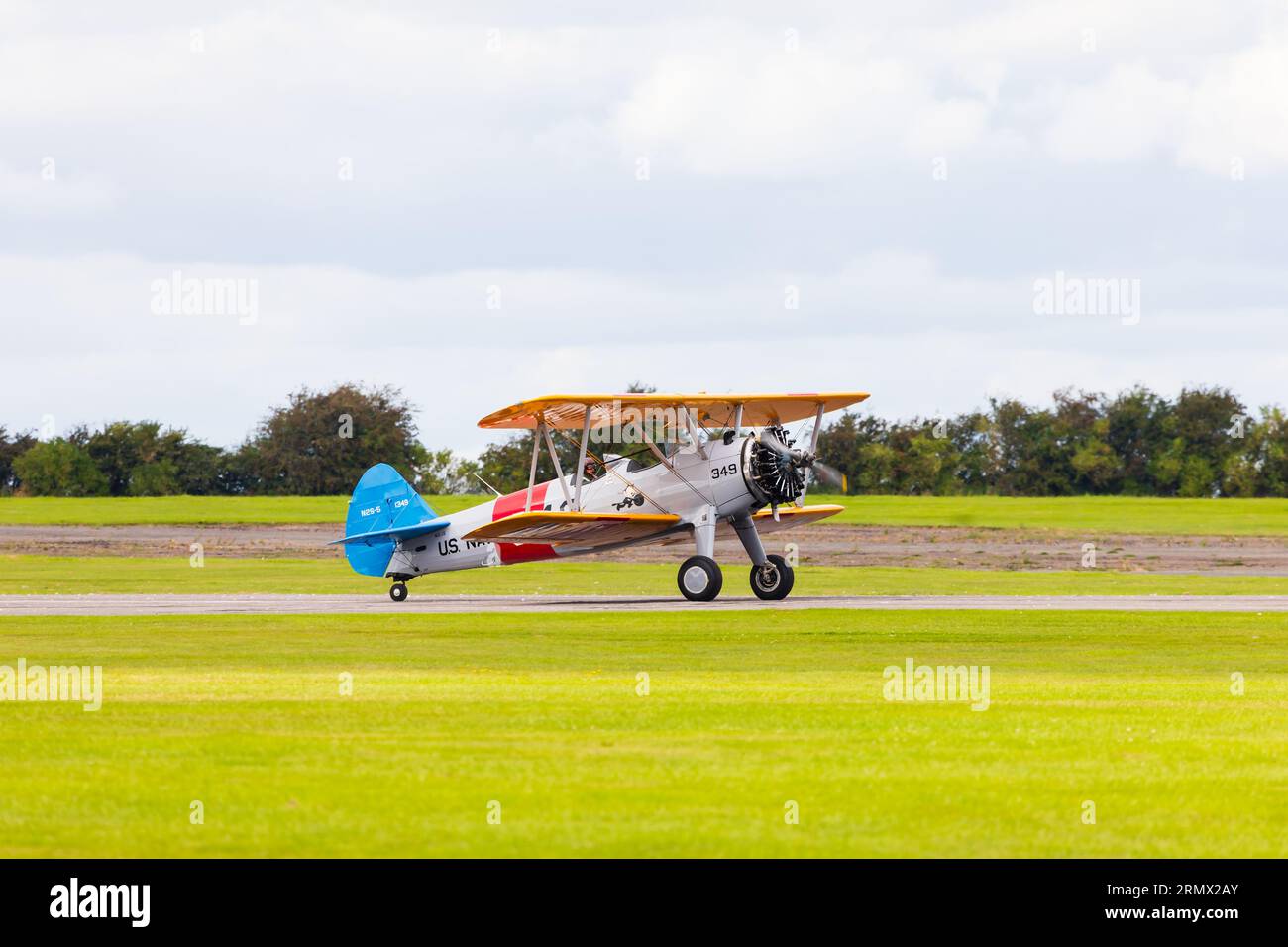 Boeing stearman Kaydet bi plane trainer of the US Navy lines up for take off. Stock Photo