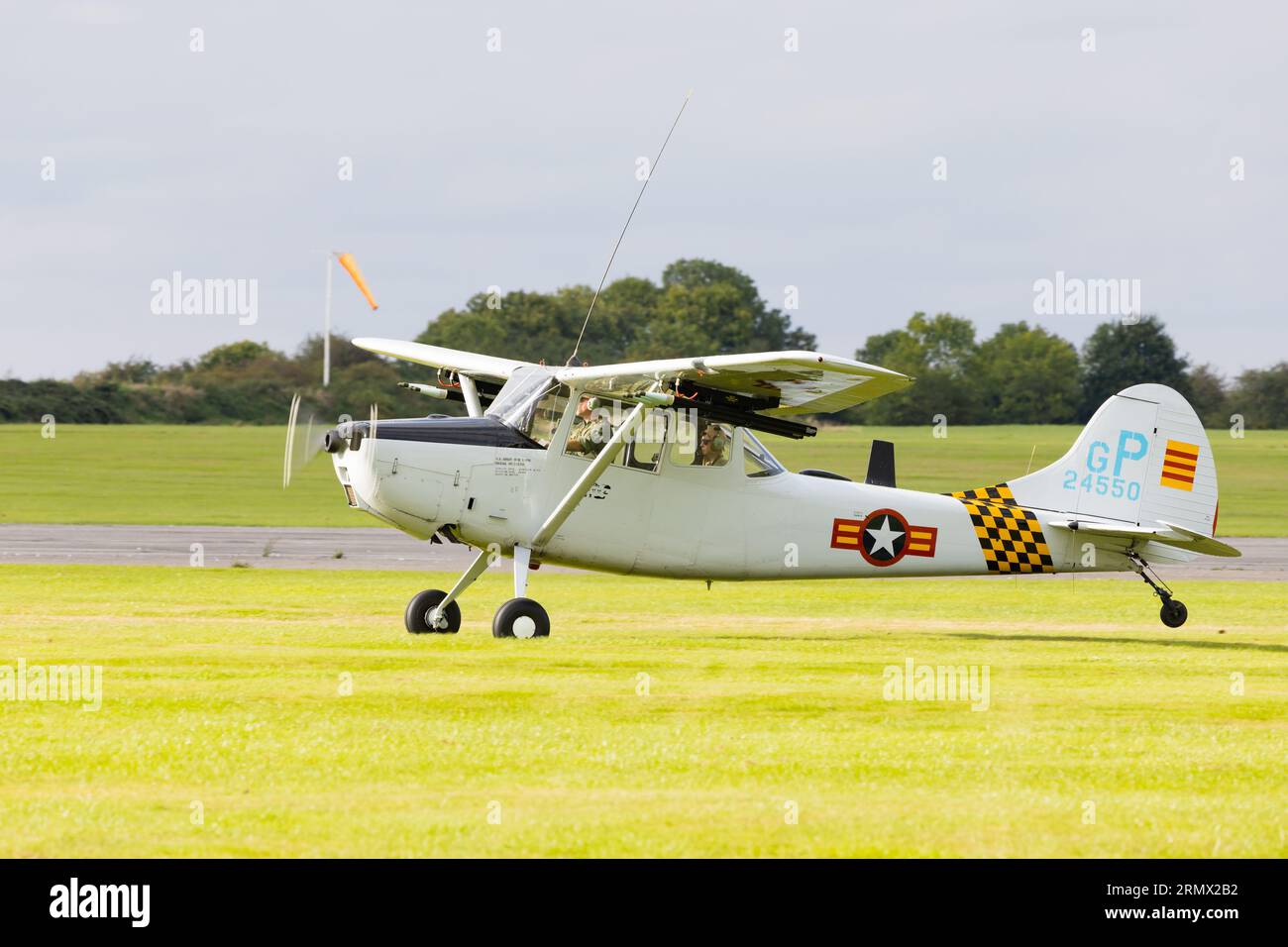 Cessna 305c, Bird Dog, GPDOG taking off from the grass Stock Photo Alamy