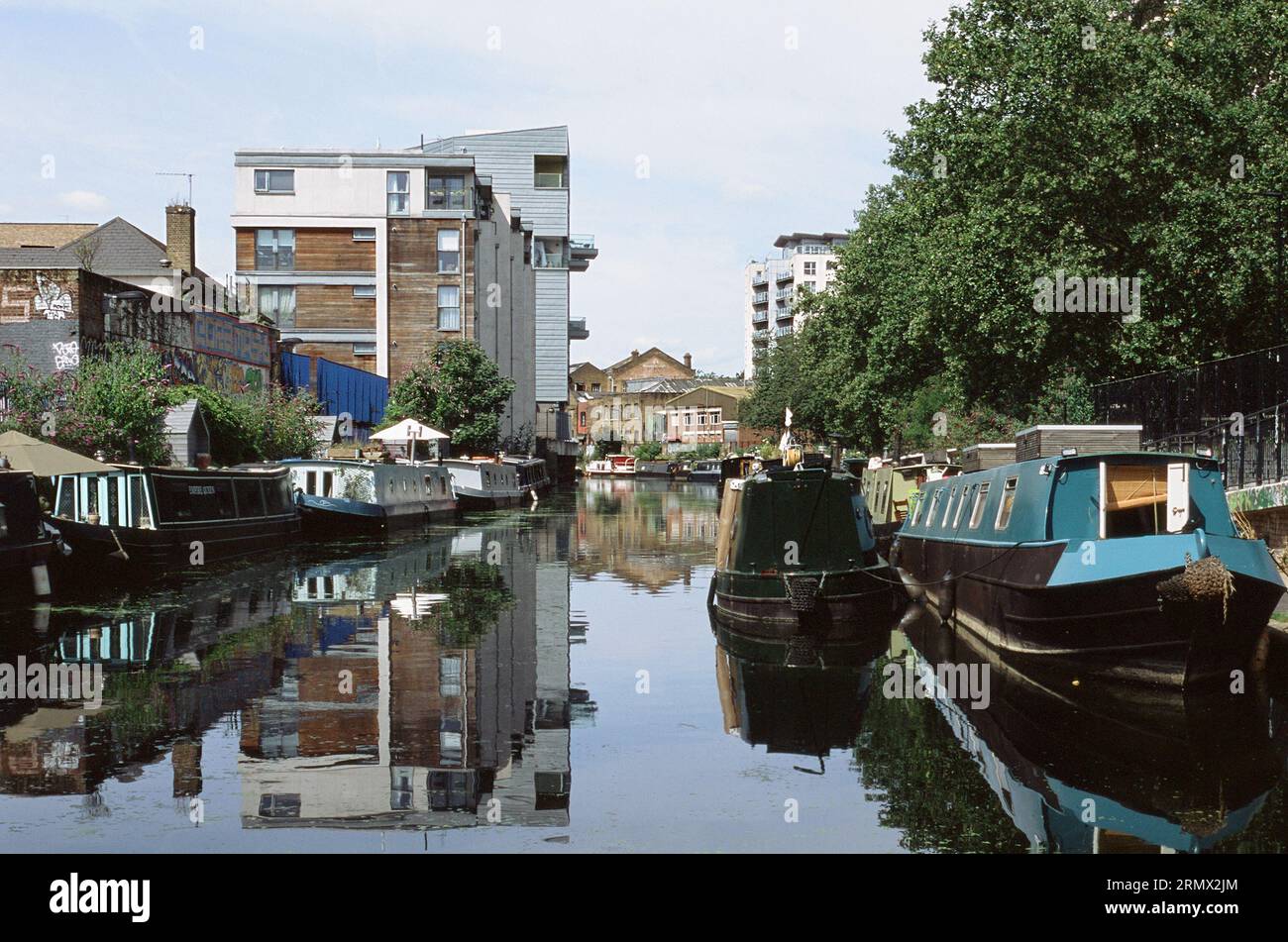 The Regent's Canal at De Beauvoir Town, Haggerston, East London UK, with narrowboats, in summertime Stock Photo