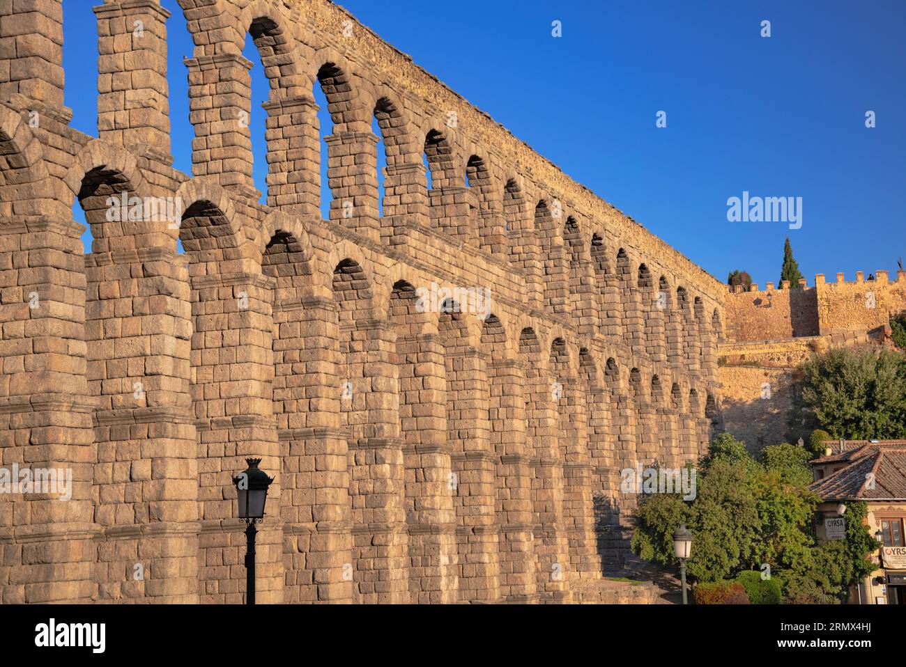 Spain, Castile and Leon, Segovia, Early morning golden light on the Aqueduct of Segovia, a Roman aqueduct with 167 arches built around the first centu Stock Photo