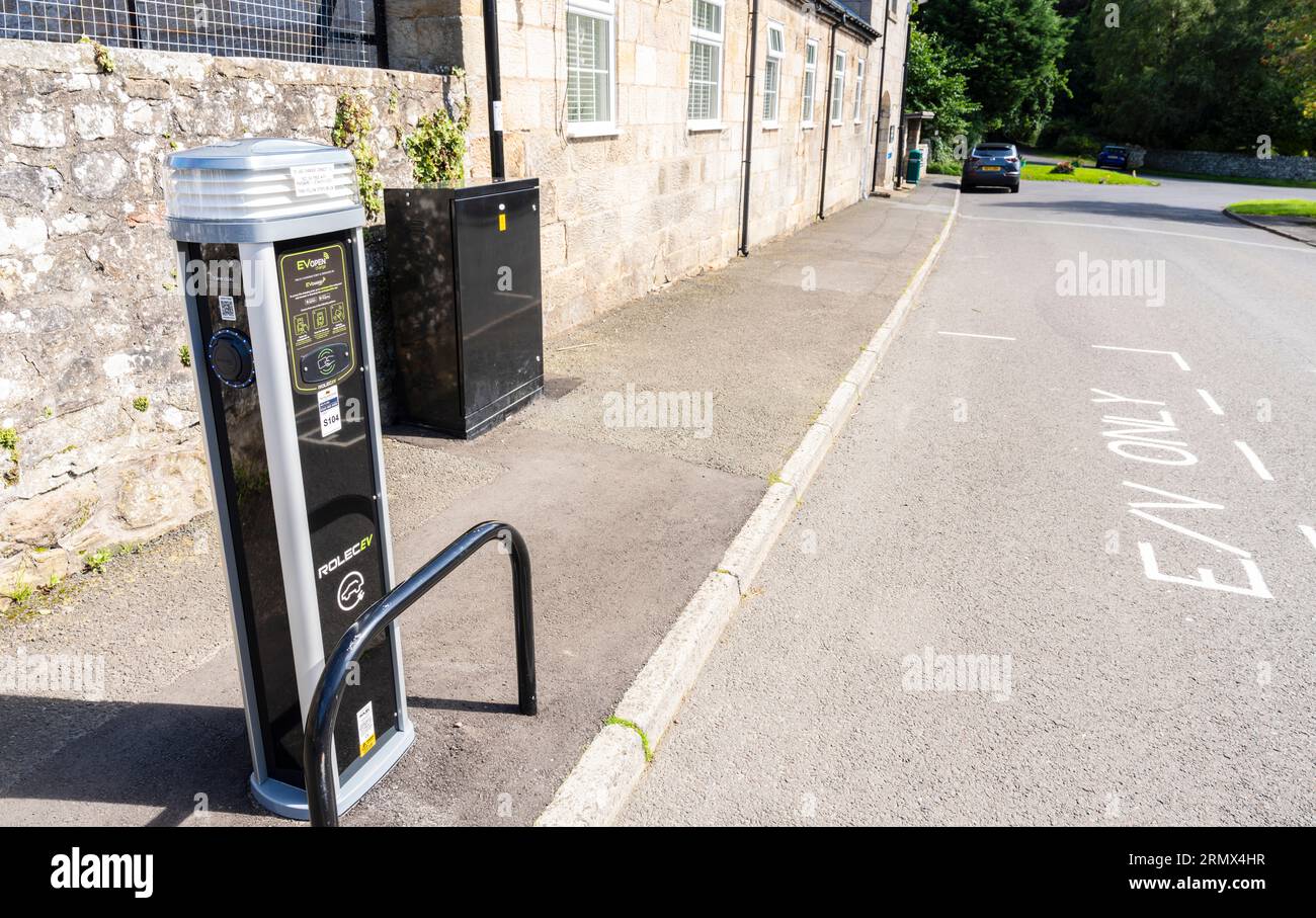 Electric vehicle charging station in a rural village in Northumberland Stock Photo