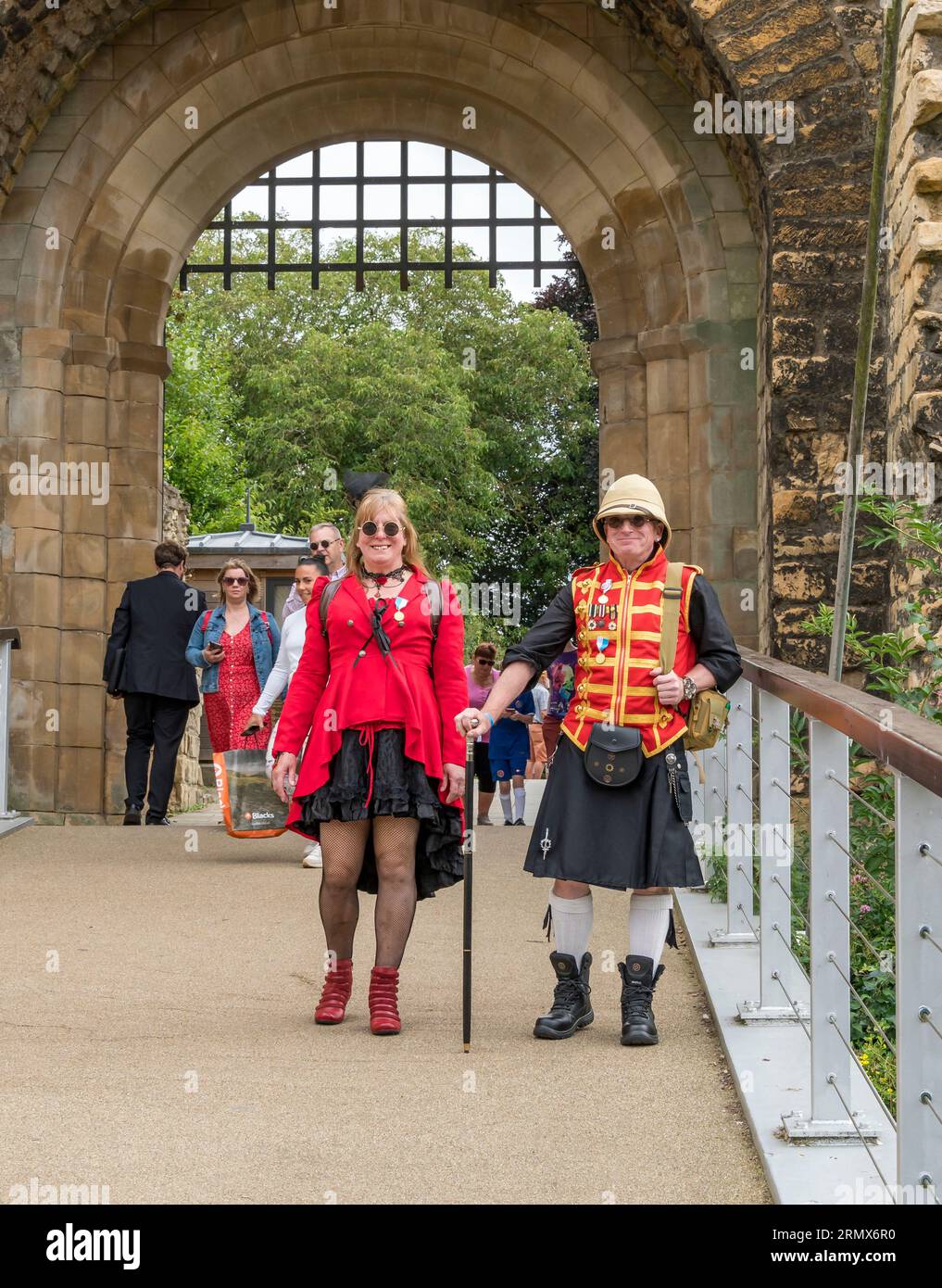 Couple in costume for Lincoln Steampunk weekend 2023, leaving castle West gate, Lincoln City, Lincolnshire, England, UK Stock Photo