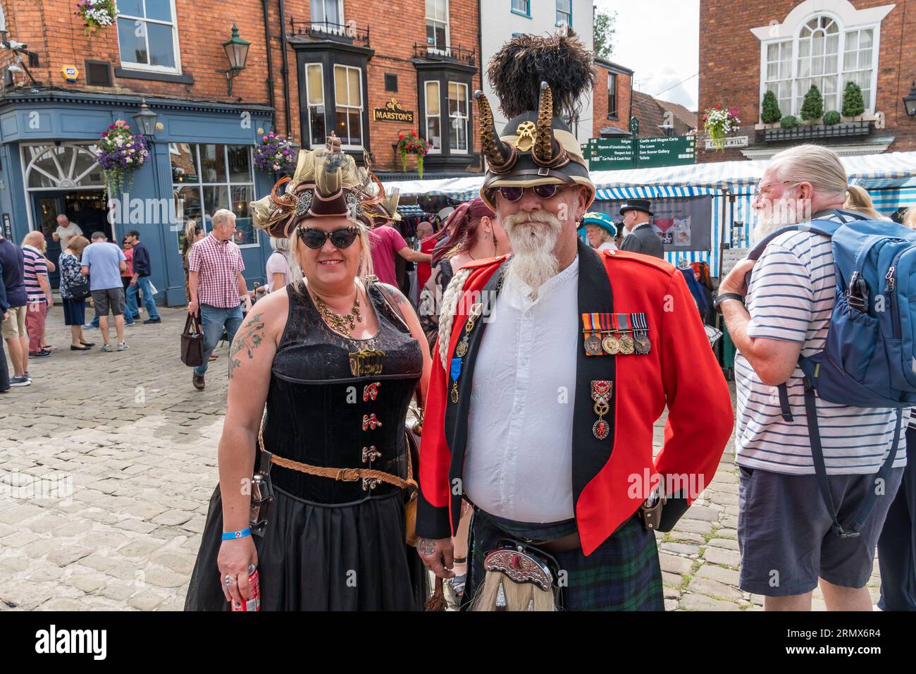 Couple in steampunk costumes, Castle hill, Lincoln City, Lincolnshire, England, UK Stock Photo