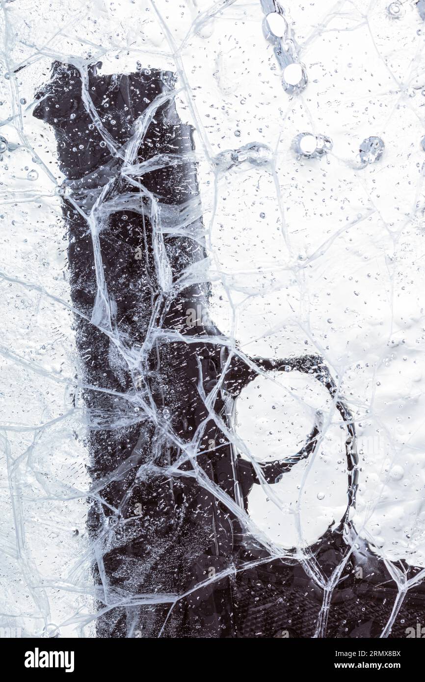 gun frozen in a sheet of ice Stock Photo Alamy