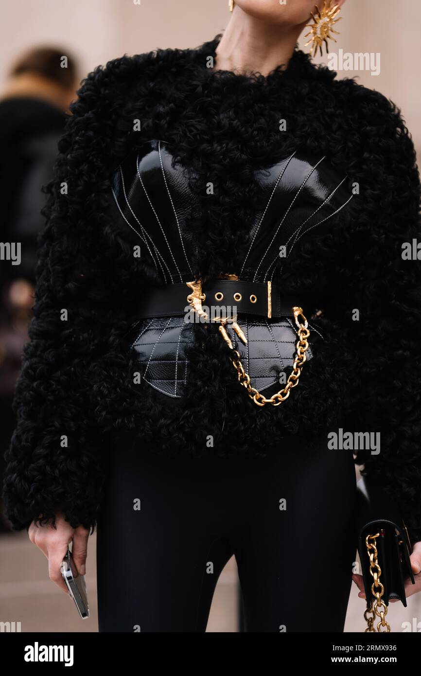Paris, France - January, 23, 2023: woman wear black shearling cardigan jacket from Schiaparelli Stock Photo