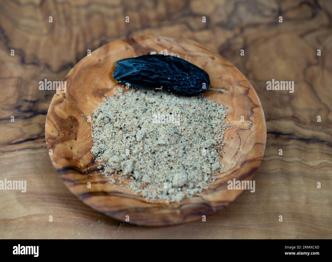 brown dutch tonka bean on olive wood Stock Photo - Alamy