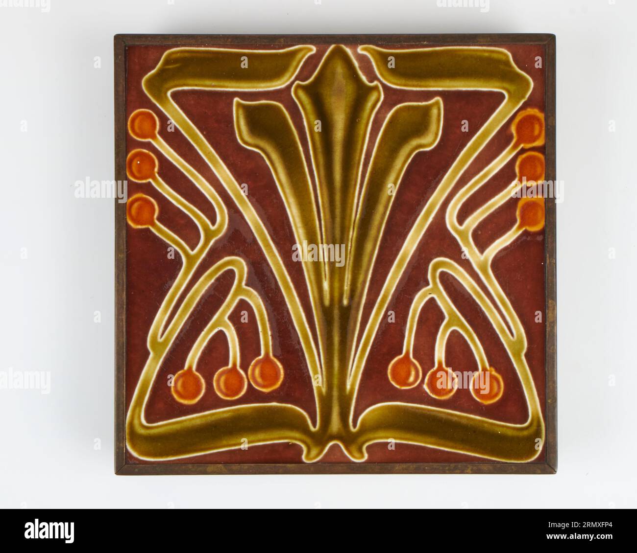 Antique 1900s Villeroy and Boch Art Nouveau pottery 8inch pottery tile trivet. Stock Photo
