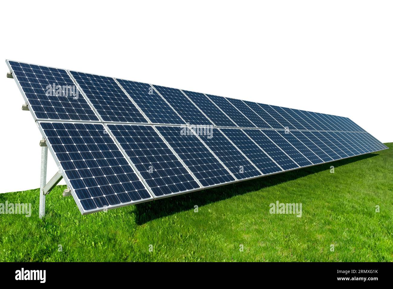 The solar panel stands on the green grass. Solar battery isolate on white background. Ecology. Environmentally friendly solar energy Stock Photo