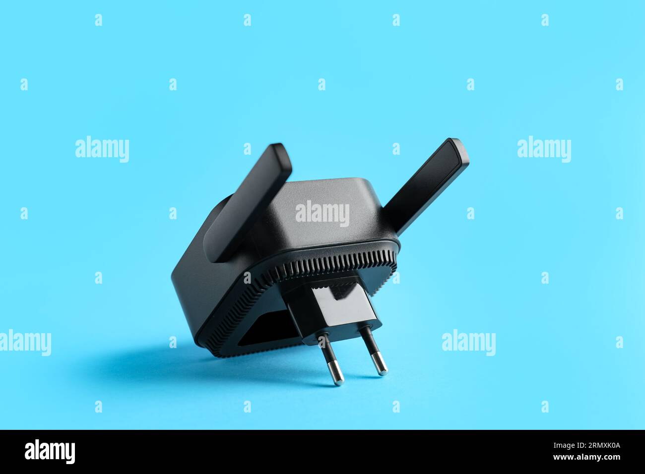 Black WiFi repeater on blue background Stock Photo