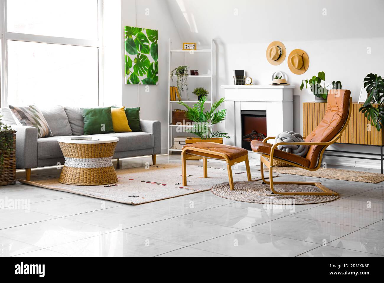 Interior of cozy living room with sofa, armchair and fireplace Stock ...