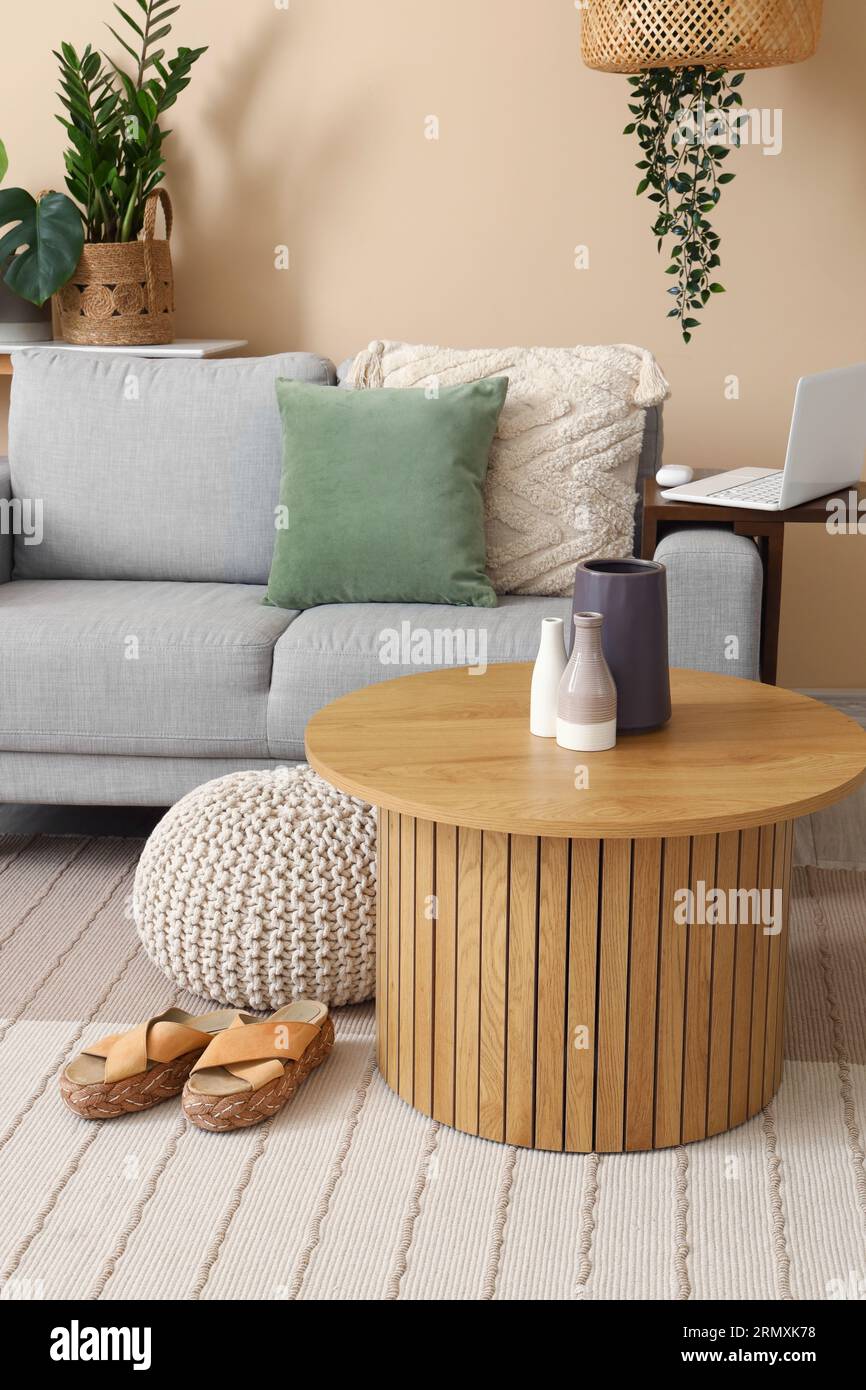 Interior of living room with cozy sofa and coffee table Stock Photo - Alamy