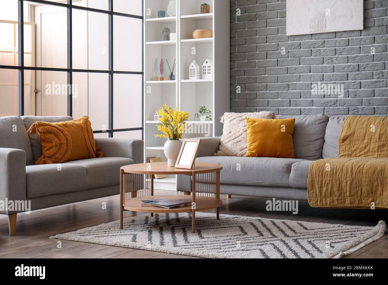 Interior of modern living room with sofas, coffee table and shelving ...