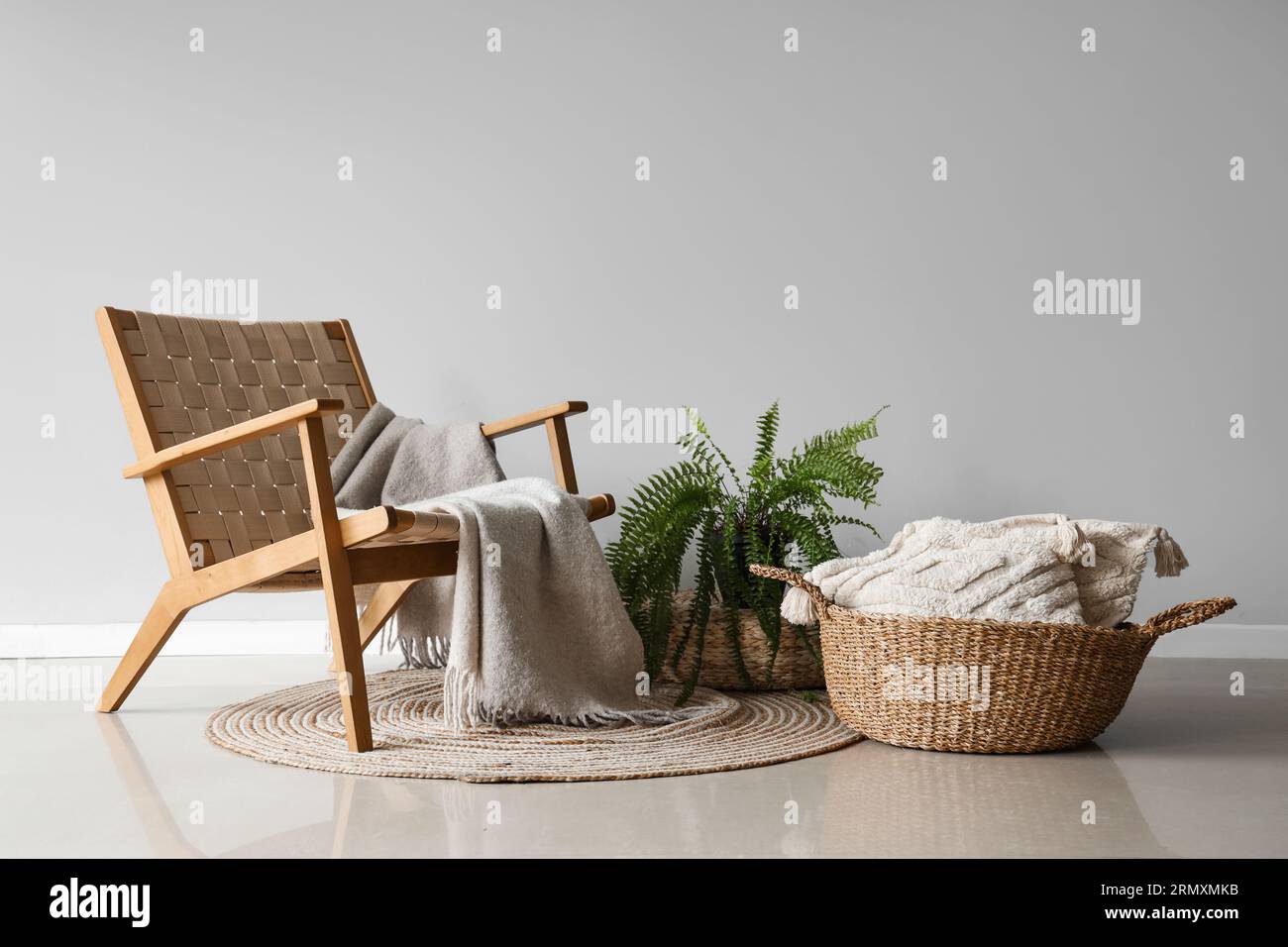 View of Interior of living room with wicker basket and chair Stock Photo - Alamy