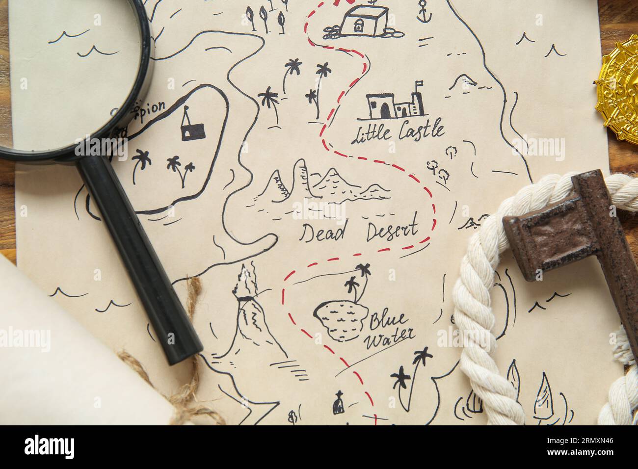 Treasure Map With Key Treasure map with magnifier and key on brown wooden background Stock ...