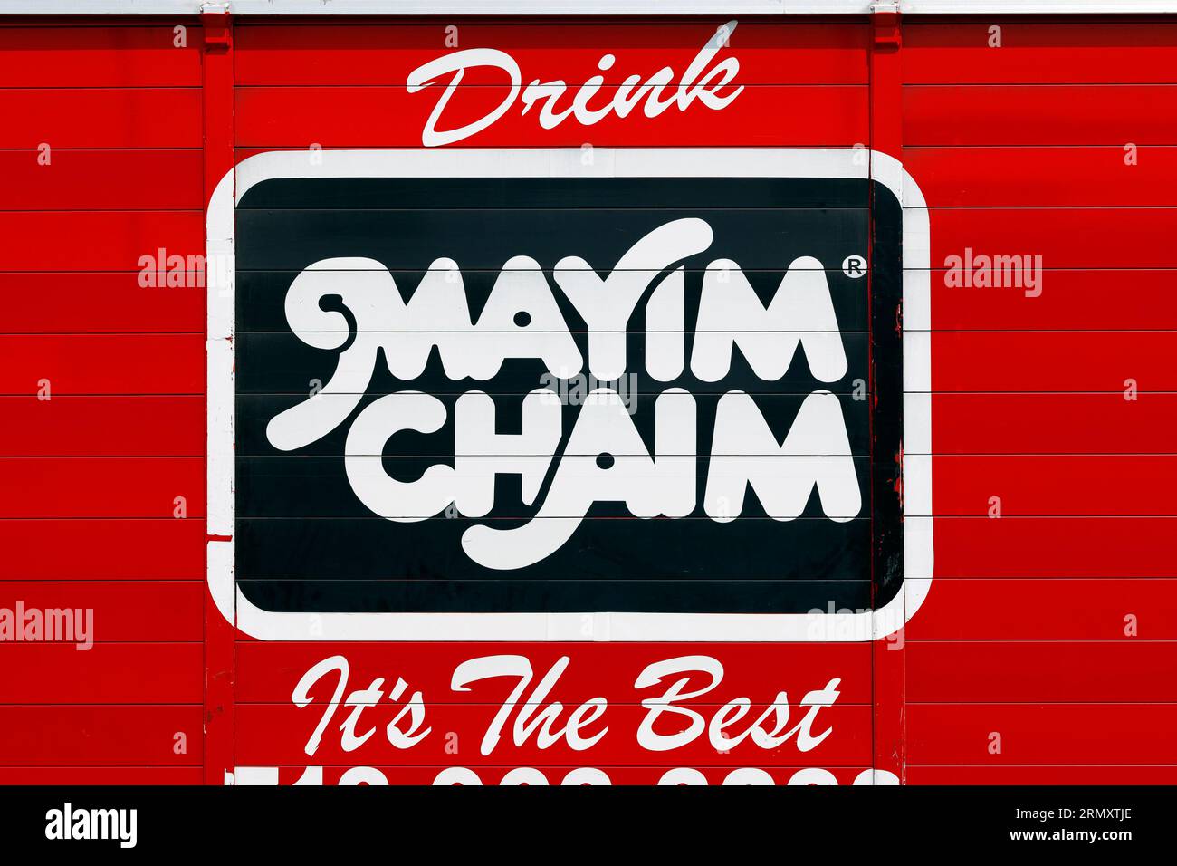 A 'Drink Mayim Chaim It's the Best' kosher soda soft drink advertisement on the side of a beverage delivery truck in Williamsburg, Brooklyn Stock Photo