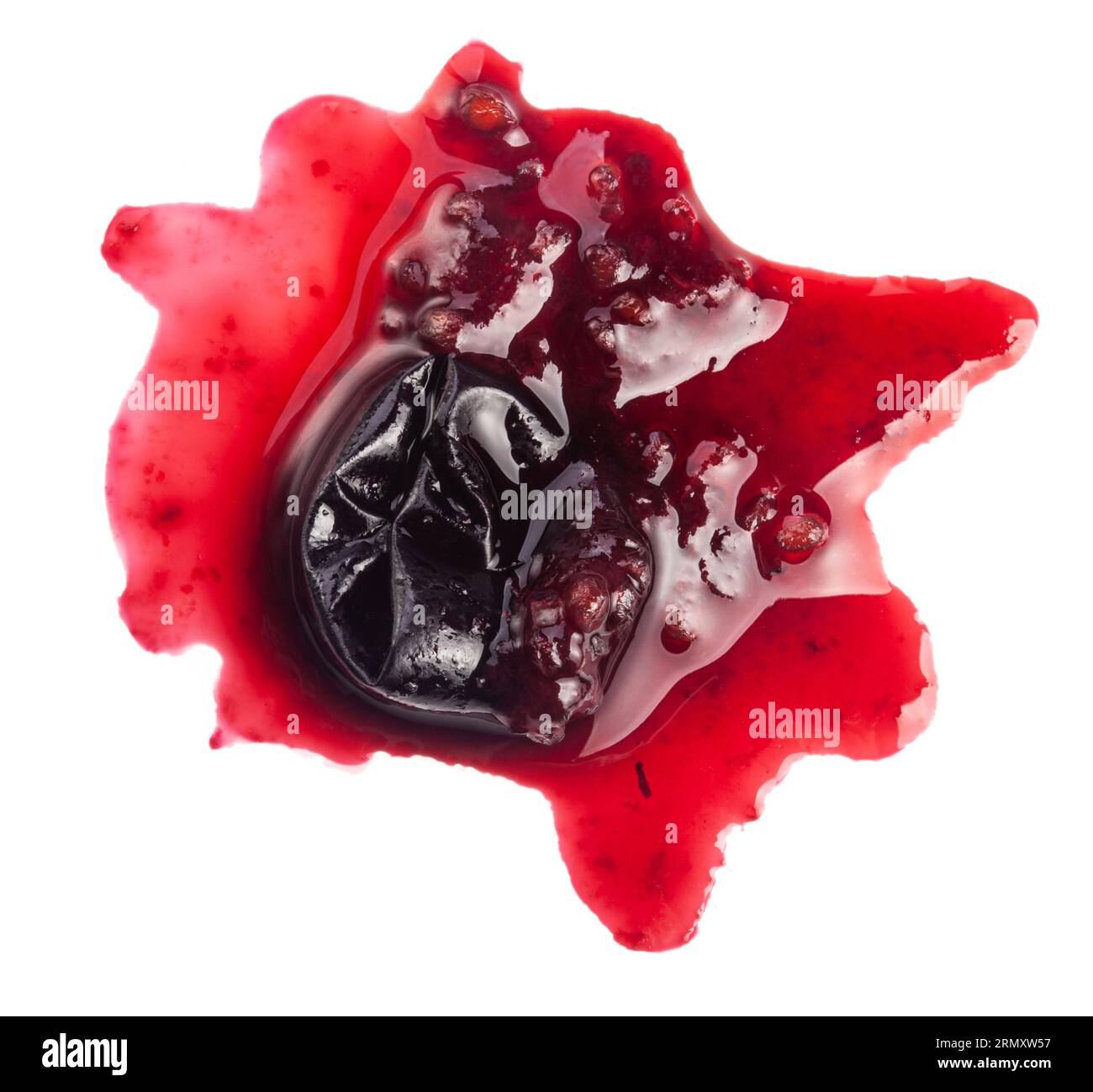 Smashed black currant berries isolated on white background Stock Photo