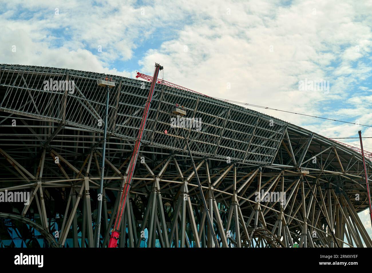 workers at the car tower work at a height Stock Photo Alamy