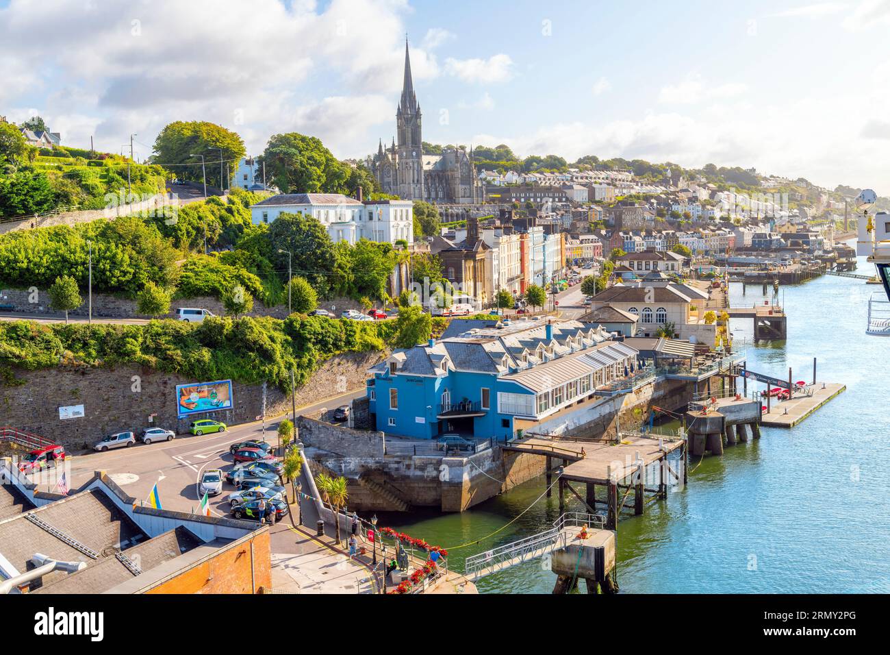 Colman's Cathedral and the skyline of the seaside city of Cobh, Ireland, the Titanic's last port of call, seen from the harbor and cruise port. Stock Photo