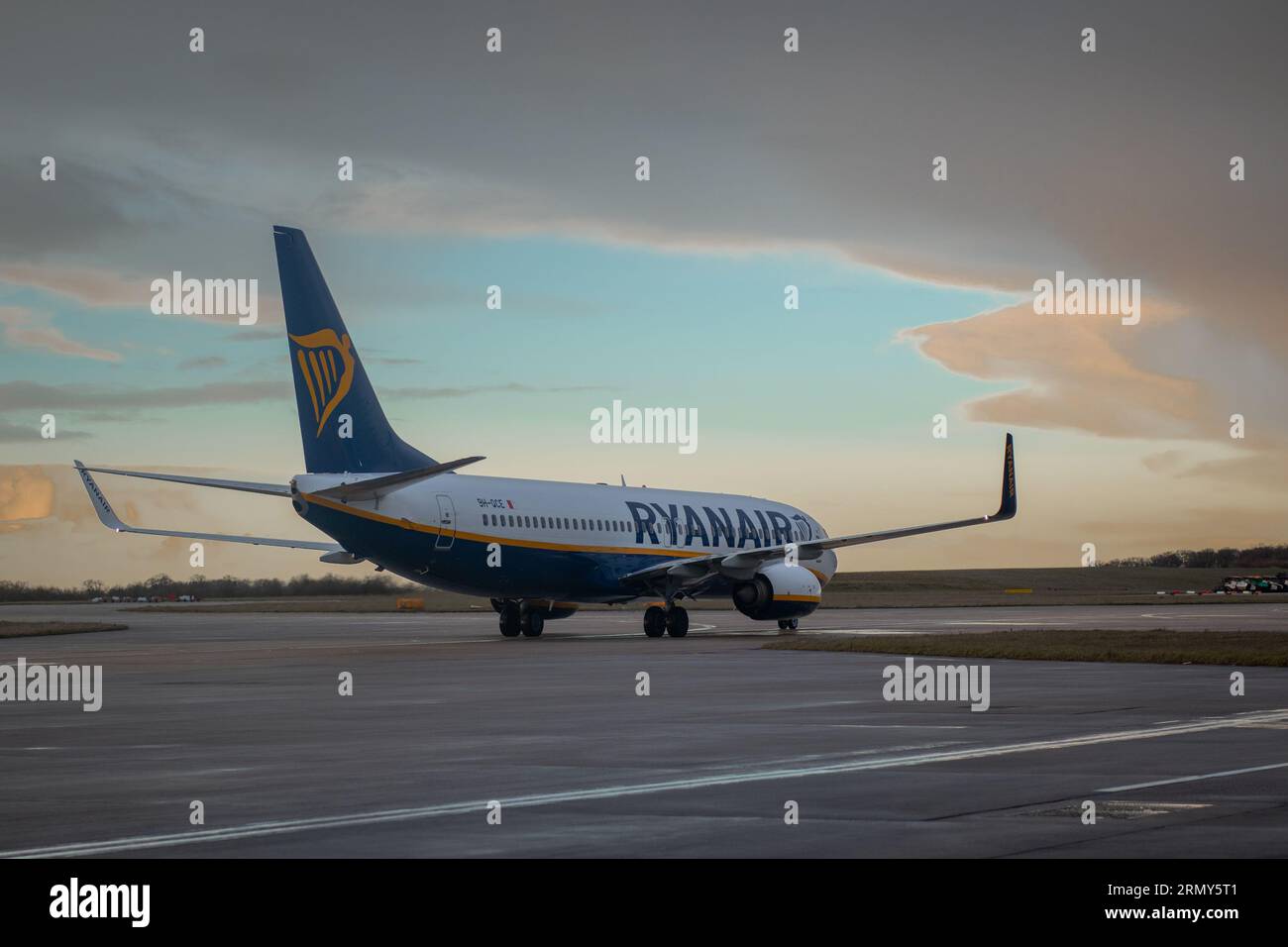 GLASGOW, UK, 24.3.2023: Ryanair Boeing 737 is standing on an apron of international airport with beautiful backlight in early morning. Stock Photo