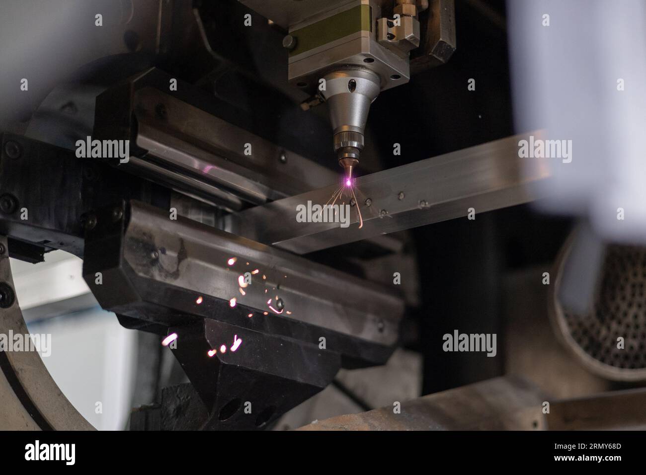 Detail of laser plasma cutter in operation when cutting and drilling