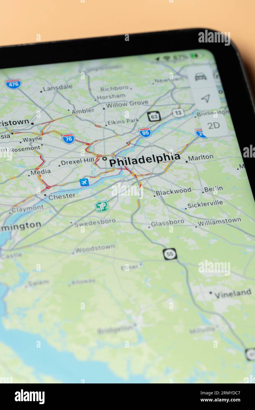 New York, USA - August 24, 2023: Car traffic in Philadelphia on google maps app on tablet screen close up view Stock Photo