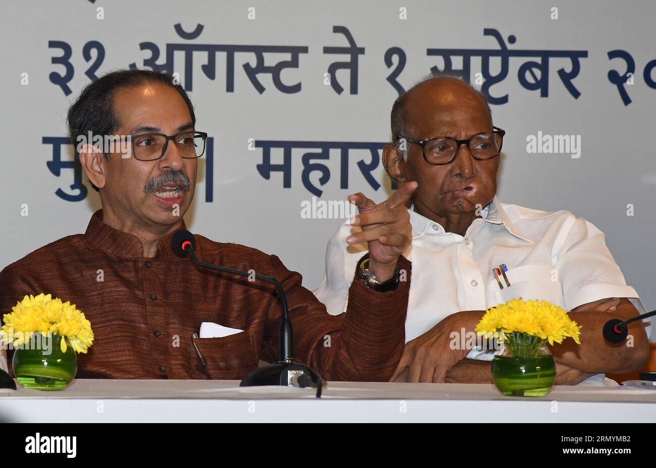 Mumbai, India. 30th Aug, 2023. L-R Shiv Sena (UBT) chief Uddhav Thackeray gestures with his hand as Nationalist Congress Party (NCP) chief Sharad Govindrao Pawar looks on during the Maha Vikas Aghadi (MVA) press conference in Mumbai. The press conference was held ahead of Indian National Developmental Inclusive Alliance (INDIA) third meeting to be held on 31st August and 1st September 2023. Credit: SOPA Images Limited/Alamy Live News Stock Photo
