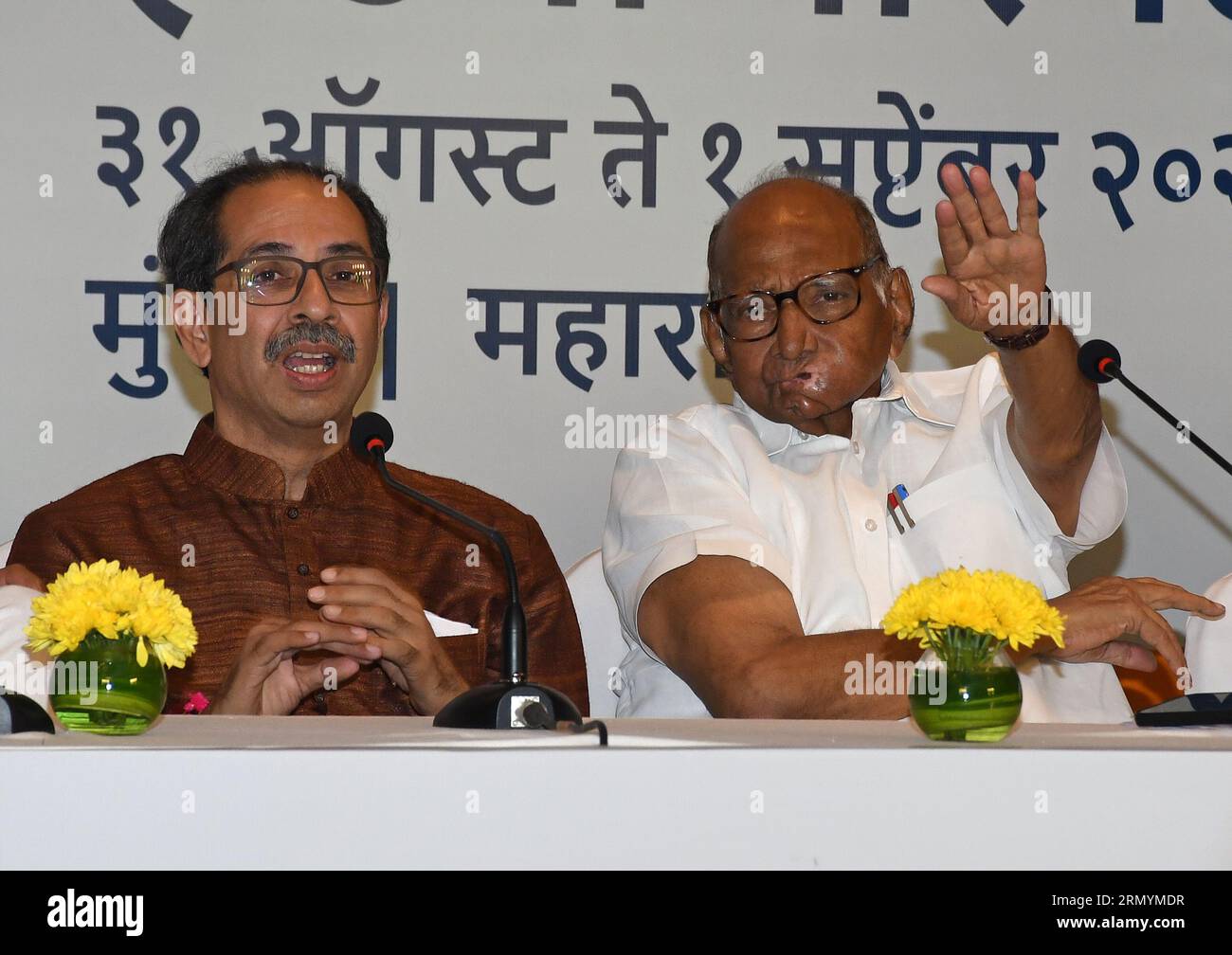 Mumbai, India. 30th Aug, 2023. L-R Shiv Sena (UBT) chief Uddhav Thackeray looks on as Nationalist Congress Party (NCP) chief Sharad Govindrao Pawar gestures with his hand during the Maha Vikas Aghadi (MVA) press conference in Mumbai. The press conference was held ahead of Indian National Developmental Inclusive Alliance (INDIA) third meeting to be held on 31st August and 1st September 2023. Credit: SOPA Images Limited/Alamy Live News Stock Photo