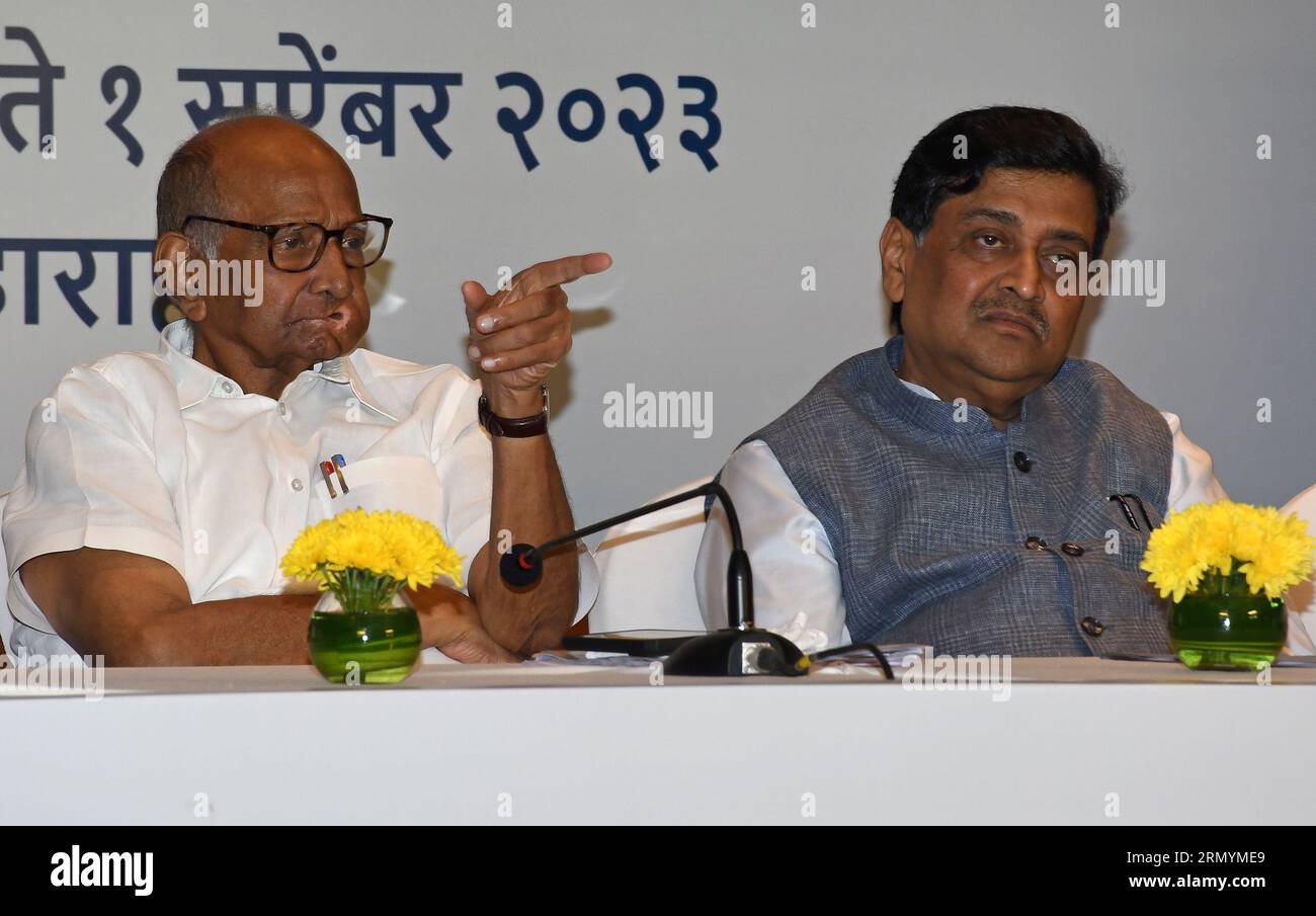 Mumbai, India. 30th Aug, 2023. Nationalist Congress Party (NCP) chief Sharad Govindrao Pawar gestures with his hand as politician Ashok Shankarrao Chavan (NCP) looks on during the Maha Vikas Aghadi (MVA) press conference in Mumbai. The press conference was held ahead of Indian National Developmental Inclusive Alliance (INDIA) third meeting to be held on 31st August and 1st September 2023. Credit: SOPA Images Limited/Alamy Live News Stock Photo
