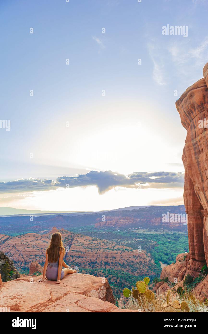 Little girl on the edge of a cliff at Cathedral Rock in Sedona, Arizona ...