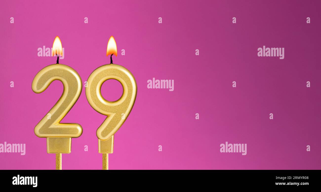 Candle number 29 in purple background - birthday card Stock Photo
