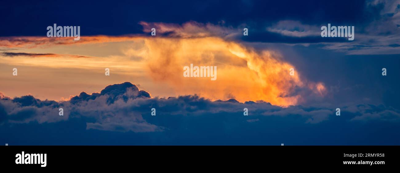 Clouds over rocky mountains hi-res stock photography and images - Alamy